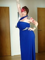 Busty Dors squeezes tits into tight blue dress and plays with pussy